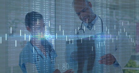 Pointing physician and nurse reviewing data overlay in hospital hall, with tablet and stethoscopes