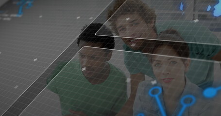 Analyzing digital grid, three tech professionals examining data in office, with network-node icons