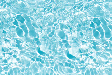 Blue water with ripples on the surface. Defocus blurred transparent blue colored clear calm water surface texture with splashes and bubbles. Water waves with shining pattern texture background.