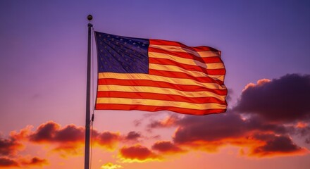 Waving American Flag Backlit by a Dramatic Purple and Orange Twilight Sky.