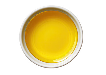 A small, round, white bowl filled with a bright yellow liquid