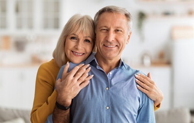 Happy Marriage. Senior Wife Embracing Her Husband Posing Together Holding Hands Smiling Looking At...