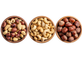 Three wooden bowls filled with various nuts.  Top-down view.  Cashews, hazelnuts, and another type of nut
