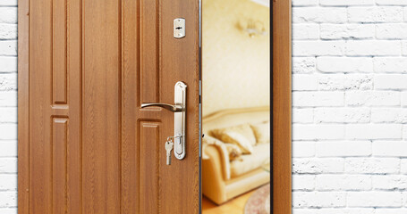 Half opened door to a living room. Door handle, door lock. Lounge door half open. Opening door....