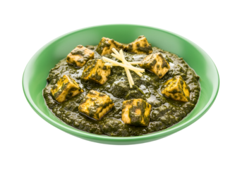 A vibrant display of paneer makhani, showcasing the rich green sauce and golden cubes of paneer, garnished with slivered ginger.