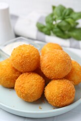 Delicious fried croquette balls on table, closeup