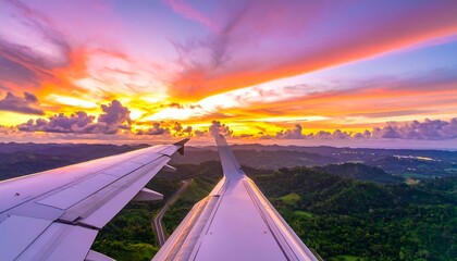 Airplane view of sunset over rolling hills