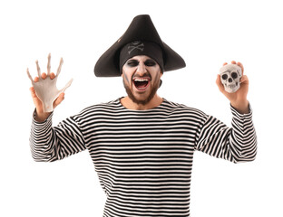 Young happy man dressed as pirate for Halloween with skeleton hand and human skull isolated on white background