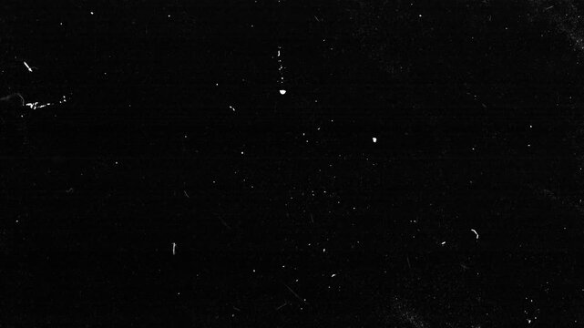Old film grunge effect showing dust and scratches on black background. Vintage black film grain texture overlay.