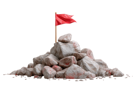 A small, red flag atop a pile of gray rocks