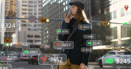 Woman speaking on smartphone in city crosswalk, with crossbody bag, traffic lights, cars, AR icons