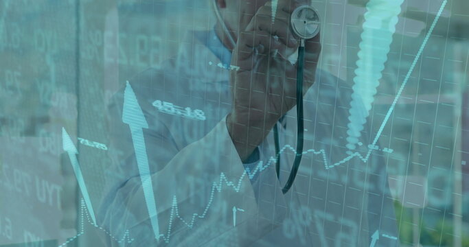 Holding stethoscope, doctor displaying financial charts in clinic, with supply bottles and plant