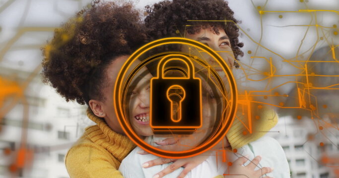 Embracing couple wearing white shirt and yellow sweater in loft, with orange padlock and circuits - Powered by Adobe
