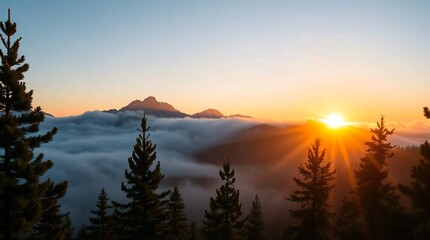 Obraz premium sunrise over misty mountain peaks