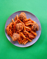 Tasty Italian style meatballs with penne pasta and tomato sauce. 