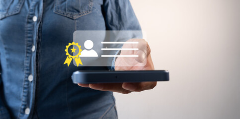 Close-up of a person holding a cell phone with an icon of a person's ID with a certificate