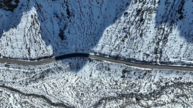 Los Caracoles highway road near Santiago Chile in aerial view. Road at Andes Mountains. Snowing scenery. Snow highway road. Winding curves near Argentina and Chile border
