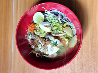 Soto Ayam in Indonesia. Soto ayam is a traditional Indonesian dish that uses ingredients such as shredded chicken, potatoes, eggs, vermicelli, bean sprouts with delicious sauce.