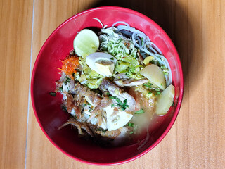 Soto Ayam in Indonesia. Soto ayam is a traditional Indonesian dish that uses ingredients such as shredded chicken, potatoes, eggs, vermicelli, bean sprouts with delicious sauce.