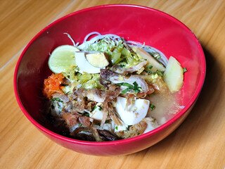 Soto Ayam in Indonesia. Soto ayam is a traditional Indonesian dish that uses ingredients such as shredded chicken, potatoes, eggs, vermicelli, bean sprouts with delicious sauce.