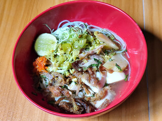 Soto Ayam in Indonesia. Soto ayam is a traditional Indonesian dish that uses ingredients such as shredded chicken, potatoes, eggs, vermicelli, bean sprouts with delicious sauce.