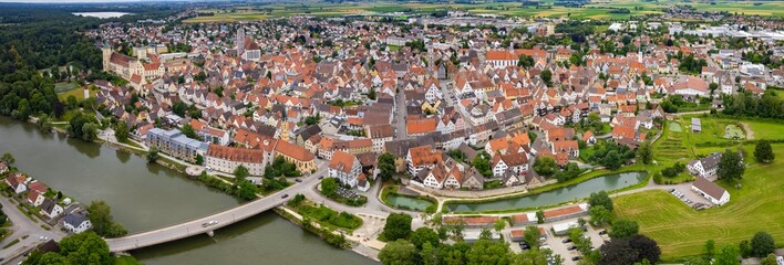 An aerial panorama view above the old town of the city Lauingen on a cloudy summer day in Bavaria, Germany