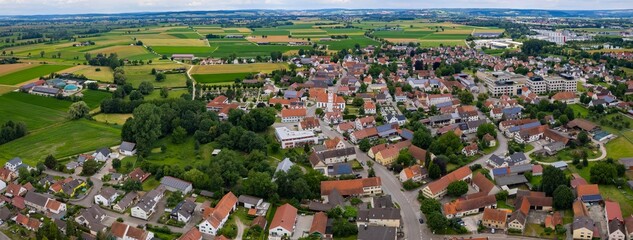 An aerial panorama view above the old town of the city Mertingen on a cloudy summer day in Bavaria, Germany