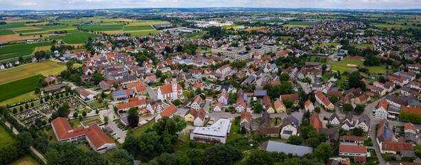 An aerial panorama view above the old town of the city Mertingen on a cloudy summer day in Bavaria, Germany