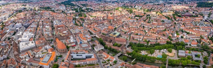 Fototapeta premium An aerial panorama view above the old town in the city Nuremberg or Nürmberg during an overcast summer day in Bavaria, Germany