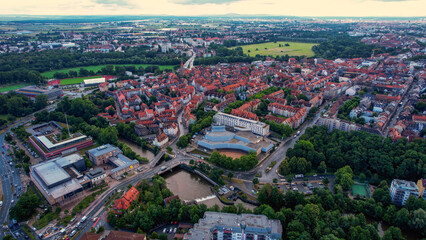 An aerial panorama view above the downtown in the city Ochsenfurt during a cloudy summer day in Bavaria, Germany