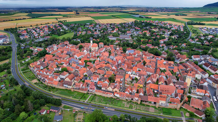 Aerial panorama view of the old town in the city Mainbernheim in Bavaria in Germany on a cloudy day in spring
