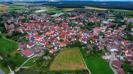  An aerial panorama view above the old town of the city Markt Erlbach on a cloudy summer day in Bavaria, Germany