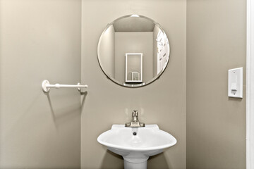 Bathroom sink with a mirror above it