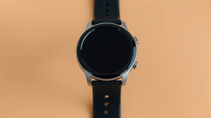 Smartwatch with black strap, and beige background.