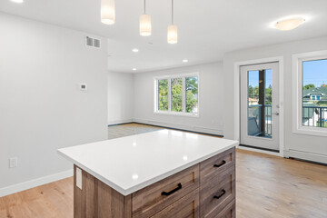 Kitchen with a white island and a window