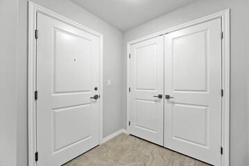 White door with a black dot on it