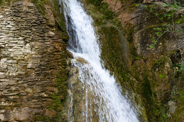 Small watefall and rocks in the mountain