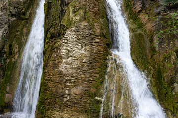 Small watefall and rocks in the mountain