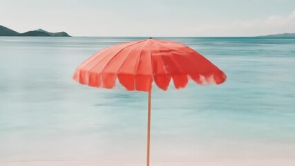 A vibrant coral umbrella casts a shade on a tranquil beach.