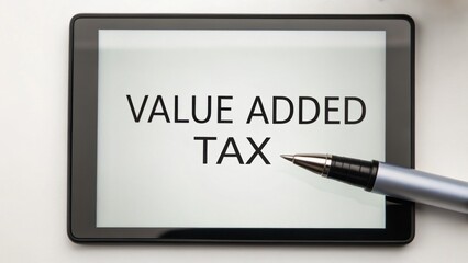 Naklejka premium Value Added Tax concept. Digital tablet displays 