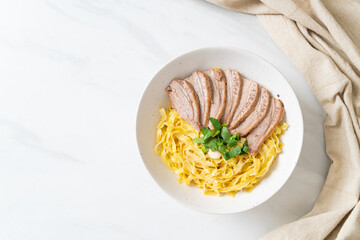 dried duck noodles in white bowl
