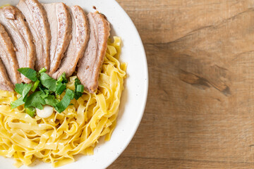 dried duck noodles in white bowl