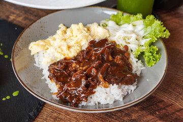 Rice Bowl Omelet, captured on September 8, 2025. Fusion dish combining fluffy omelet over steamed rice with rich Indonesian flavors, savory modern comfort food with local culinary touch