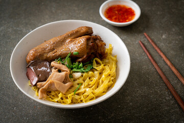 Egg noodles served dry with braised duck