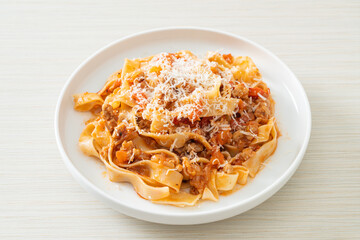 Homemade pasta fettuccine bolognese with cheese
