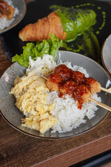 Rice Bowl Omelet, captured on September 8, 2025. Fusion dish combining fluffy omelet over steamed rice with rich Indonesian flavors, savory modern comfort food with local culinary touch