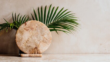 Beige marble disc with palm leaves