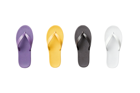Colorful flip-flops in purple, yellow, black, and white isolated on a white background.