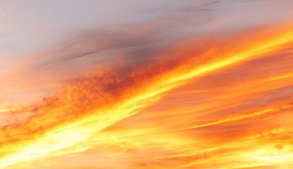 Fiery sunset clouds ablaze with orange and gold hues