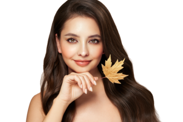 Portrait of beautiful young woman with autumn leafs. Healthy clean fresh skin natural make up.Long curly hairstyle. Care and beauty hair products